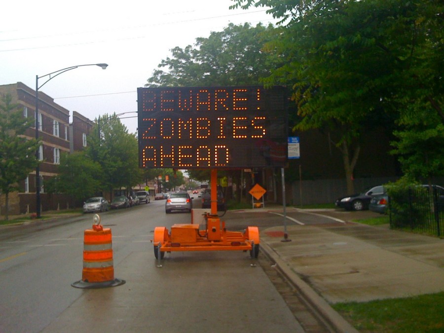 A hacked road sign in Chicago in 2009, one of many over the years to be illicitly reprogrammed to warn about a non-existent zombie uprising. (Amy Guth / Flickr)