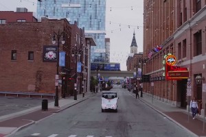 A self-driving shuttle from May Mobility navigating a city street