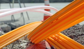 Orange pipes for fiber optics in a city road construction