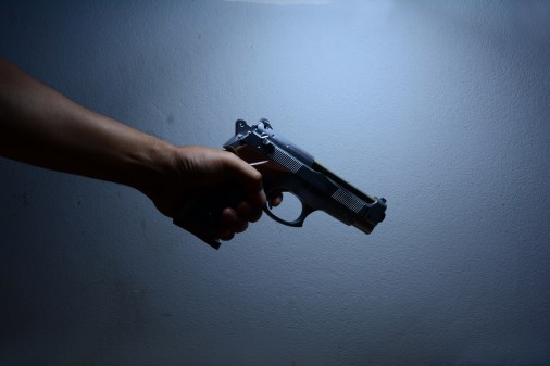 arm holding handgun