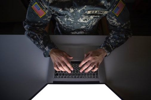 top view of soldier at laptop