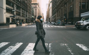 woman walking in NYC wearing mask