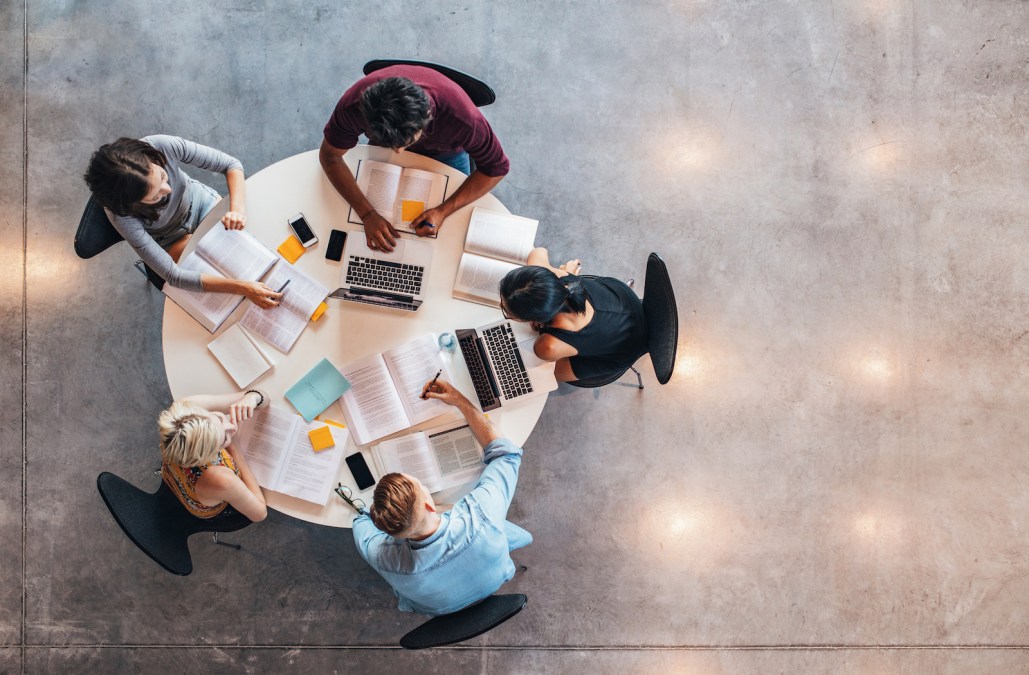 university students sitting at a round table