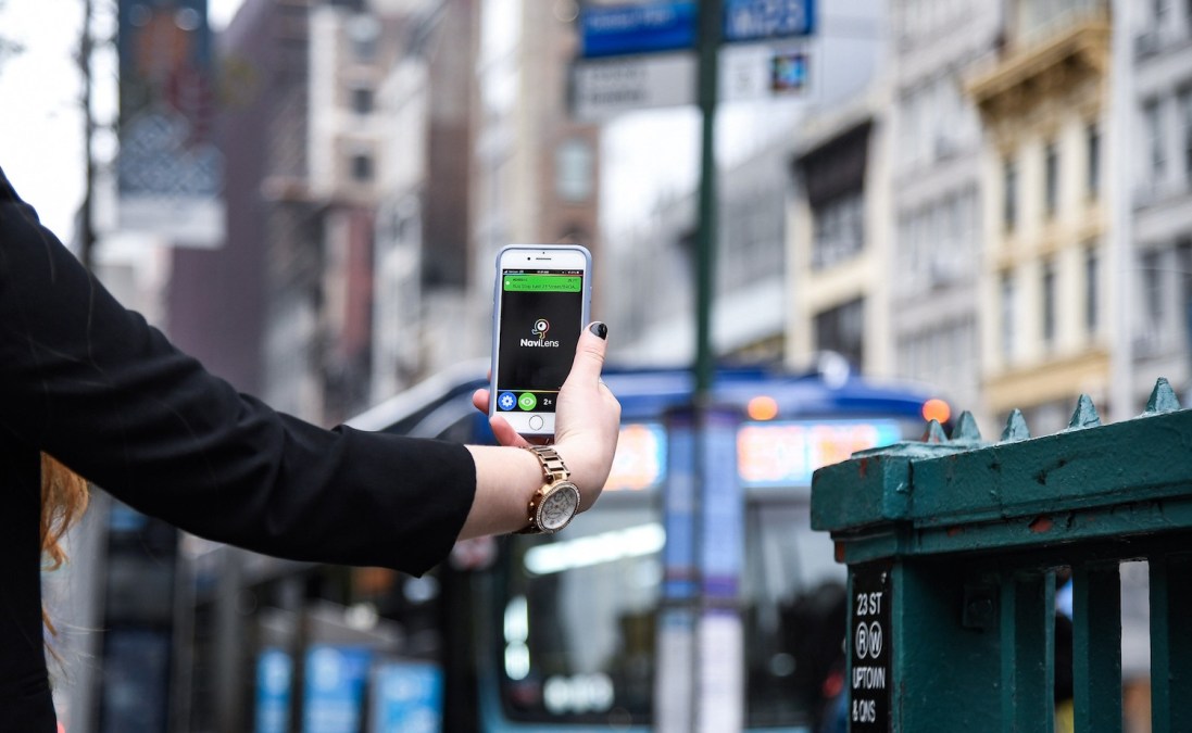 hand holding MTA app in NYC