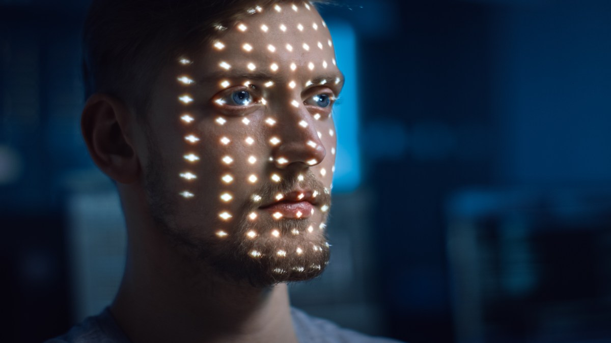 young man getting his face scanned