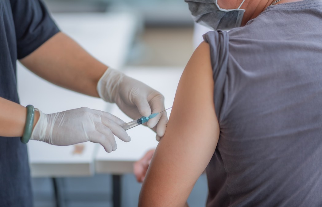 person giving an injection