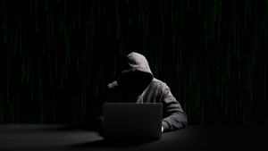 hoodie hacker guy + matrix background