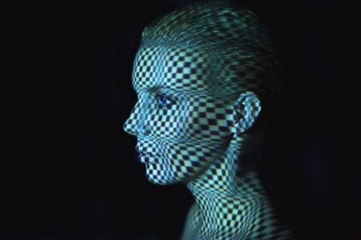 light grid projected on woman's face