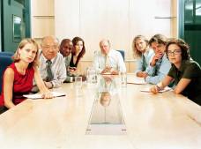 office workers at meeting table