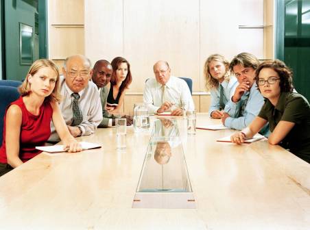 office workers at meeting table