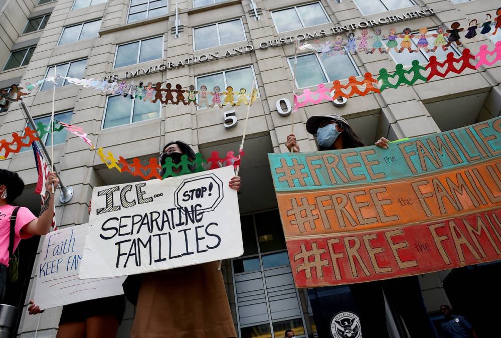 Demonstrators protest outside the Immigration and Customs Enforcement