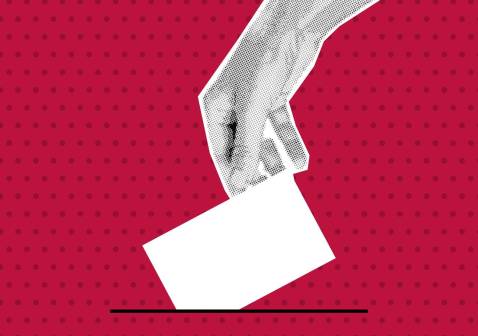 hand putting ballot in box