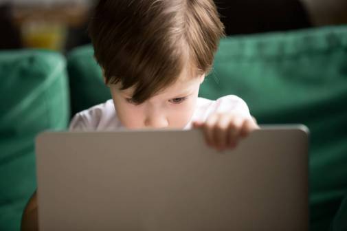 kid using laptop