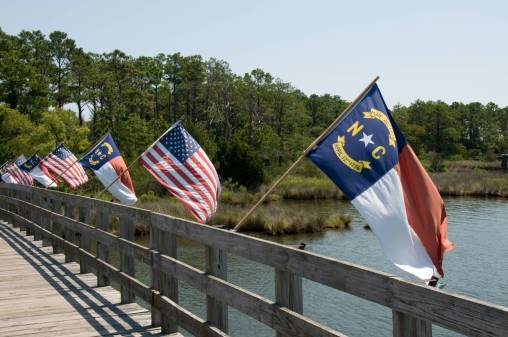 North Carolina flags on a bridge