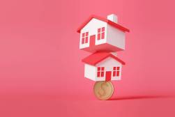 houses balancing on a coin