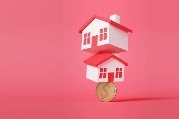 houses balancing on a coin