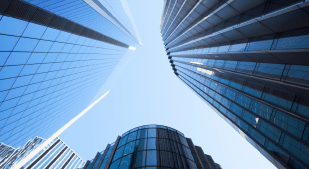 View looking skyward of rising office towers.