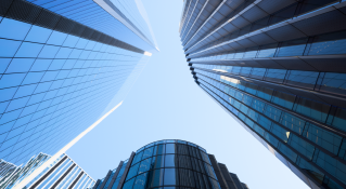 View looking skyward of rising office towers.