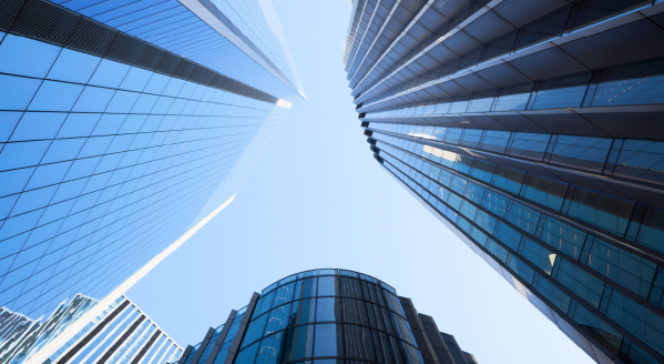 View looking skyward of rising office towers.