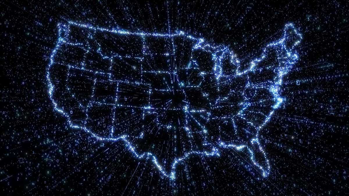 Outline map of US states in glowing blue with exploding streams of binary data illustrating communication, internet and technology